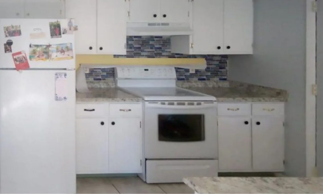 Before: Kitchen before the remodel: dated white kitchen