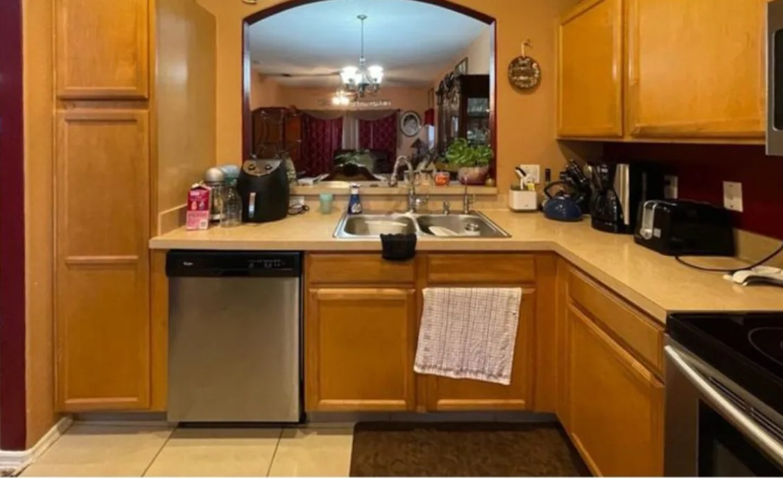 Before: Kitchen before the remodel: oak cabinets