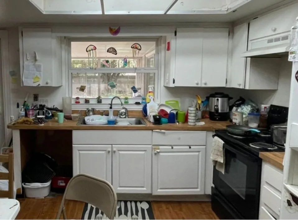 Before: Kitchen before the remodel: cluttered dated kitchen